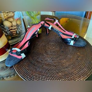 A black and white patent strappy 2.5 inch heel shoe by Caligarius